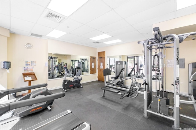 445 Seaside Ave Unit 3704, Honolulu, HI 96815 - exercise room with a paneled ceiling and baseboards