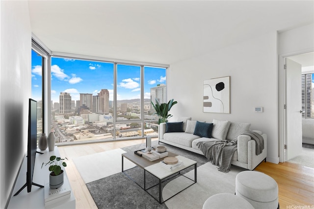 1001 Queen St Unit 1815, Honolulu, HI 96814 - living room with wood finished floors and floor to ceiling windows