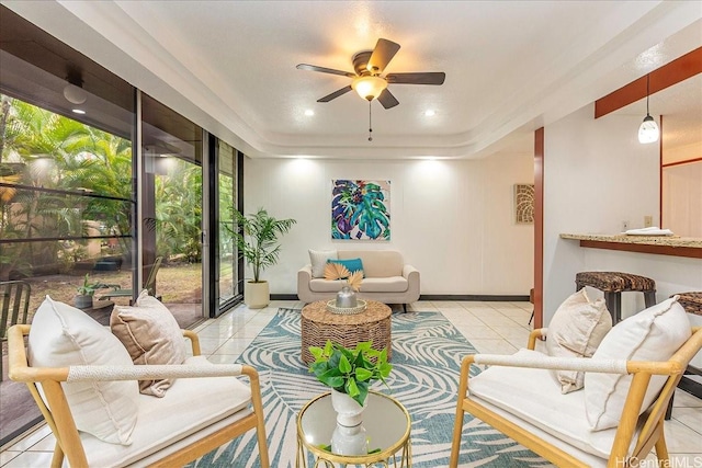 98-380 Koauka Loop Unit 304, Aiea, HI 96701 - living area with a ceiling fan, tile patterned floors, baseboards, and a raised ceiling