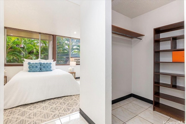 98-380 Koauka Loop Unit 304, Aiea, HI 96701 - bedroom with light tile patterned floors and baseboards