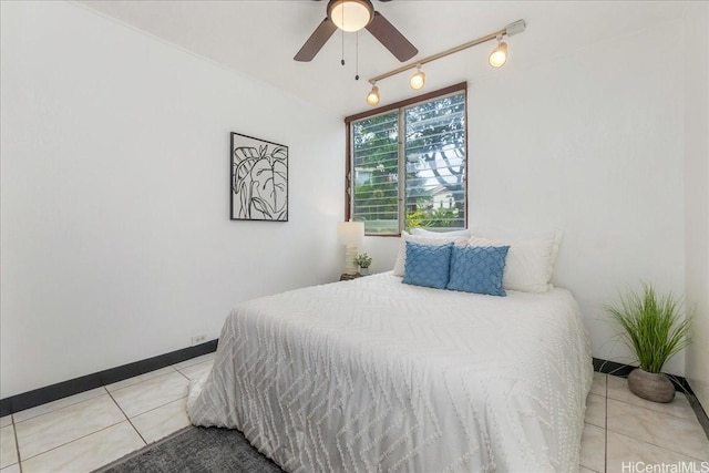 98-380 Koauka Loop Unit 304, Aiea, HI 96701 - bedroom with light tile patterned floors, rail lighting, and ceiling fan