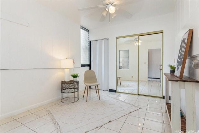 98-380 Koauka Loop Unit 304, Aiea, HI 96701 - living area featuring ceiling fan, tile patterned flooring, and baseboards