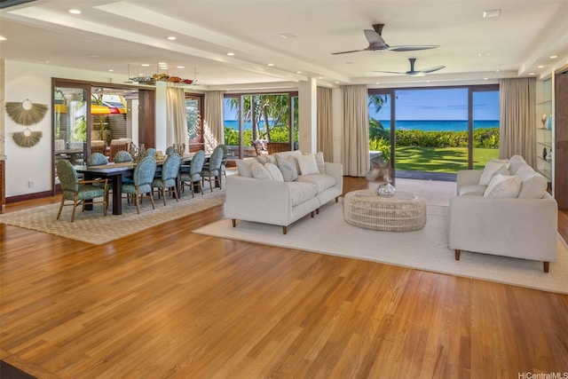 958 Mokulua Dr, Kailua, HI 96734 - living area with wood finished floors, ceiling fan, recessed lighting, and a water view