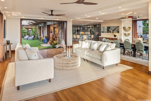 958 Mokulua Dr, Kailua, HI 96734 - living area featuring a ceiling fan, recessed lighting, wood finished floors, plenty of natural light, and a tray ceiling