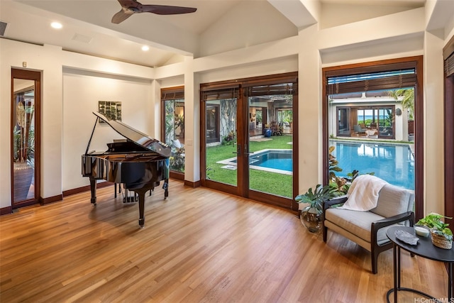 958 Mokulua Dr, Kailua, HI 96734 - living area with lofted ceiling, light wood-type flooring, ceiling fan, baseboards, and recessed lighting