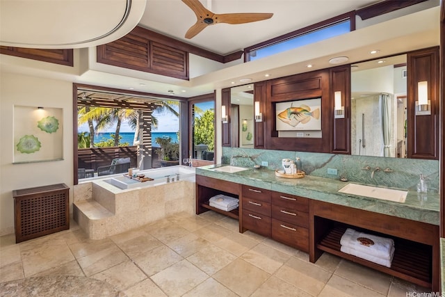 958 Mokulua Dr, Kailua, HI 96734 - bathroom featuring a bath, a ceiling fan, double vanity, and tasteful backsplash