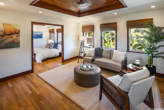 958 Mokulua Dr, Kailua, HI 96734 - living area with a tray ceiling, light wood-type flooring, baseboards, recessed lighting, and wooden ceiling