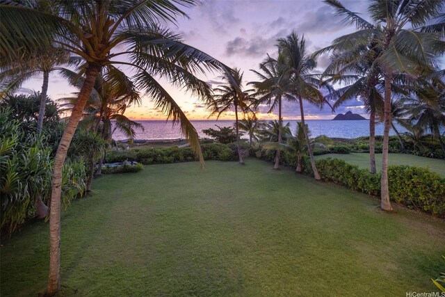 958 Mokulua Dr, Kailua, HI 96734 - yard at dusk with a water view and a yard