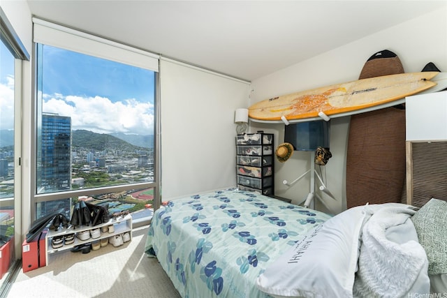 1001 Queen St Unit 3315, Honolulu, HI 96814 - bedroom featuring expansive windows, carpet flooring, a mountain view, and a view of city