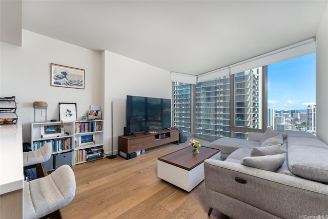 1001 Queen St Unit 3315, Honolulu, HI 96814 - living area with wood finished floors, plenty of natural light, and floor to ceiling windows