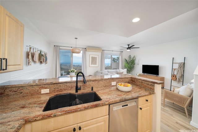 92-1143 Panana St Unit 1505, Kapolei, HI 96707 - kitchen with stainless steel dishwasher, light brown cabinets, a sink, open floor plan, and light stone countertops