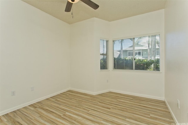 95-1030 Ainamakua Dr Unit 4, Mililani, HI 96789 - spare room with light wood-type flooring, ceiling fan, and baseboards