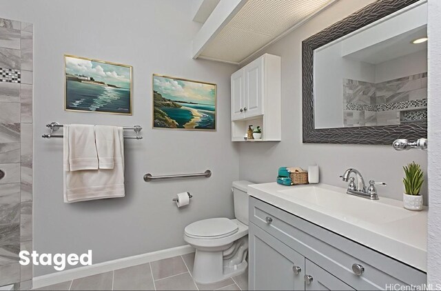 95-1030 Ainamakua Dr Unit 4, Mililani, HI 96789 - bathroom featuring vanity, a tile shower, toilet, tile patterned floors, and baseboards