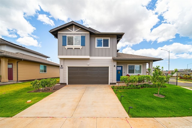 91-1811 Kapeku Loop, Ewa Beach, HI 96706 - view of front of house featuring board and batten siding, a garage, driveway, and a front yard