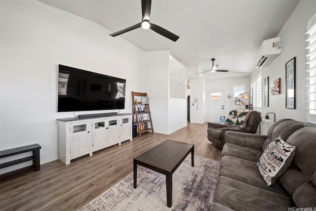 91-1811 Kapeku Loop, Ewa Beach, HI 96706 - living room with ceiling fan, a wall mounted air conditioner, wood finished floors, and vaulted ceiling