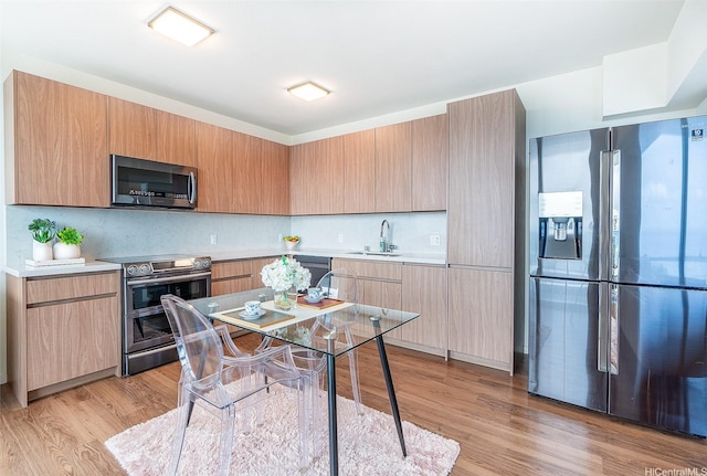 1391 Kapiolani Blvd Unit 4111, Honolulu, HI 96814 - kitchen with stainless steel appliances, light wood-type flooring, light countertops, a sink, and tasteful backsplash