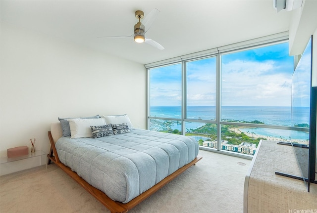 1391 Kapiolani Blvd Unit 4111, Honolulu, HI 96814 - bedroom featuring a wall of windows, a water view, carpet, and a ceiling fan