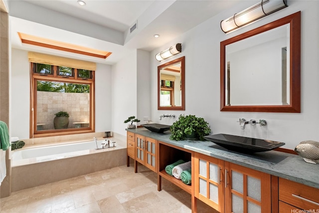 4498 Pahoa Ave, Honolulu, HI 96816 - full bathroom featuring double vanity, a garden tub, and recessed lighting