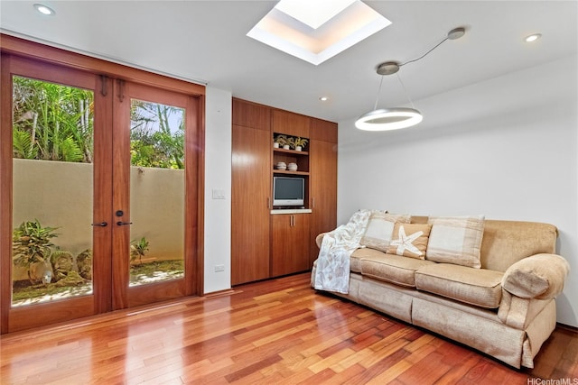 4498 Pahoa Ave, Honolulu, HI 96816 - living room with a skylight, light wood finished floors, french doors, and recessed lighting