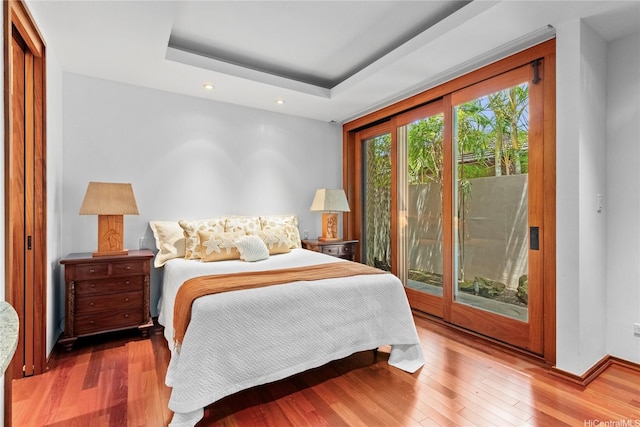 4498 Pahoa Ave, Honolulu, HI 96816 - bedroom with access to exterior, wood finished floors, recessed lighting, and a tray ceiling