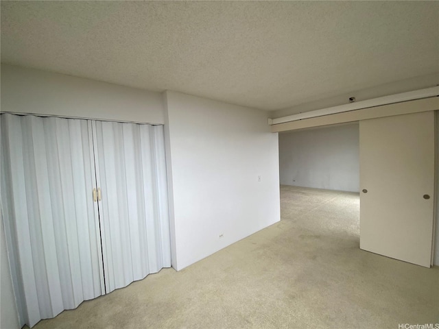 98-501 Koauka Loop Unit A1008, Aiea, HI 96701 - unfurnished bedroom with light colored carpet and a textured ceiling
