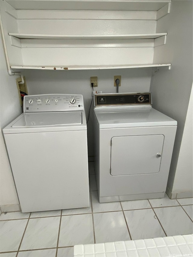 98-501 Koauka Loop Unit A1008, Aiea, HI 96701 - laundry room featuring washer and clothes dryer and light tile patterned floors