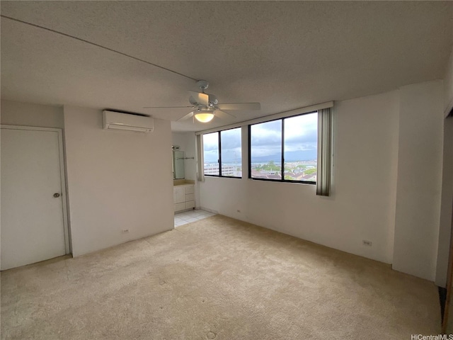 98-501 Koauka Loop Unit A1008, Aiea, HI 96701 - empty room featuring a wall mounted AC, light carpet, ceiling fan, and a textured ceiling