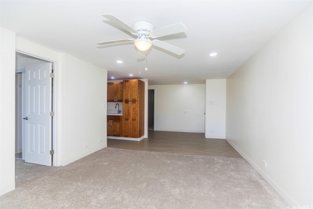 801 Ala Nioi Pl Unit 706, Honolulu, HI 96818 - unfurnished living room with carpet floors, recessed lighting, ceiling fan, a sink, and baseboards