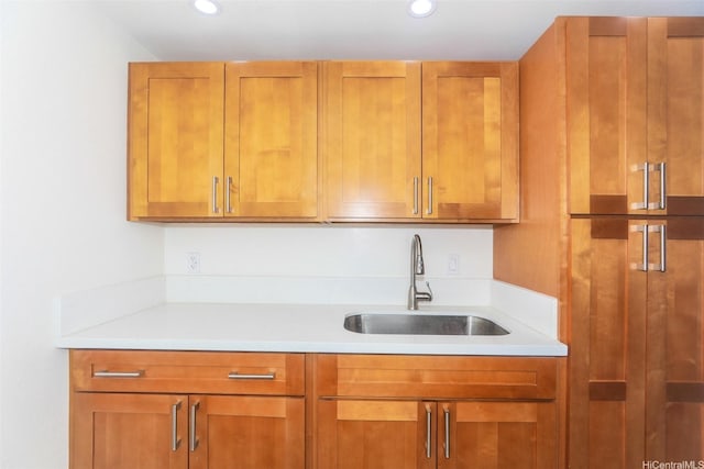 801 Ala Nioi Pl Unit 706, Honolulu, HI 96818 - kitchen with a sink, light countertops, brown cabinetry, and recessed lighting