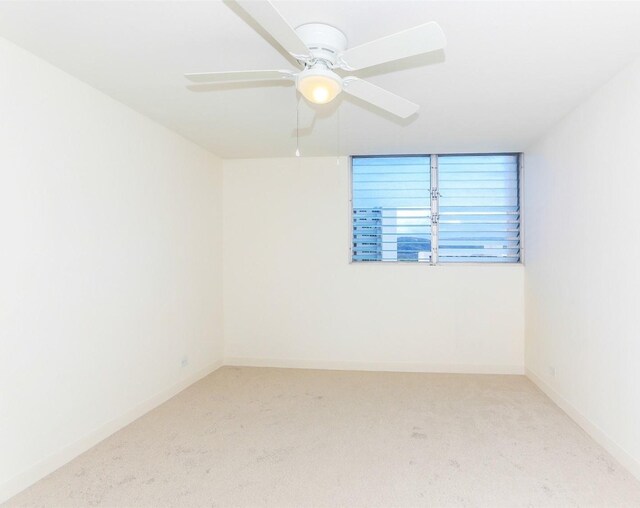 801 Ala Nioi Pl Unit 706, Honolulu, HI 96818 - carpeted spare room featuring ceiling fan and baseboards