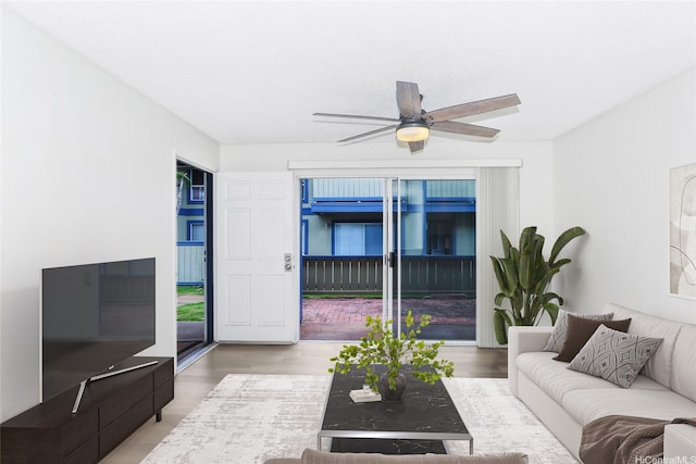 91-233 Hanapouli Cir Unit 29C, Ewa Beach, HI 96706 - living room featuring a ceiling fan and wood finished floors