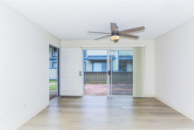 91-233 Hanapouli Cir Unit 29C, Ewa Beach, HI 96706 - empty room with wood finished floors, baseboards, and ceiling fan