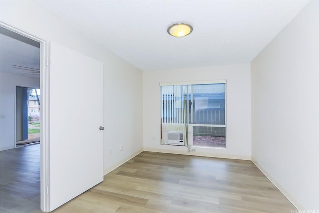 91-233 Hanapouli Cir Unit 29C, Ewa Beach, HI 96706 - empty room with wood finished floors and baseboards