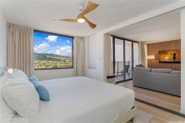201 Ohua Ave Unit 2601-2, Honolulu, HI 96815 - bedroom featuring light wood-type flooring, access to exterior, and a ceiling fan