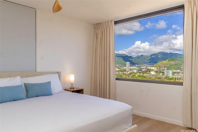201 Ohua Ave Unit 2601-2, Honolulu, HI 96815 - bedroom featuring a mountain view, light wood-style floors, baseboards, and ceiling fan