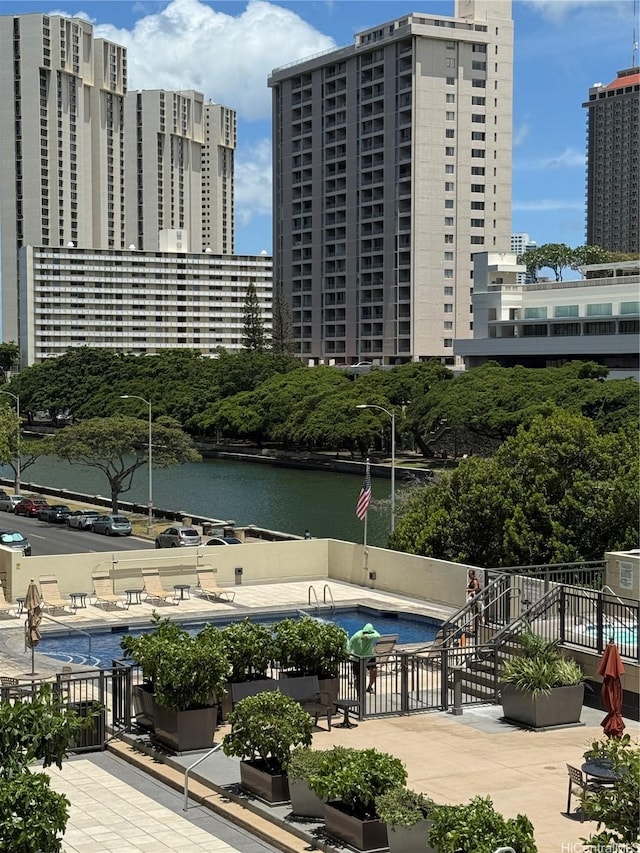 1717 Ala Wai Blvd Unit 501, Honolulu, HI 96815 - view of property with a community pool, a view of city, and a water view