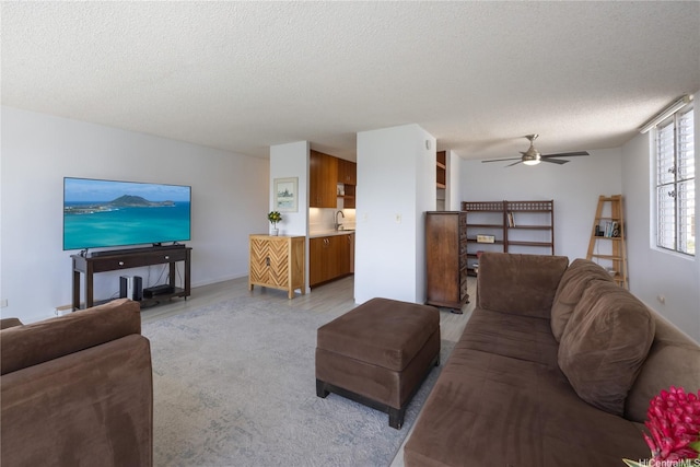 2233 Ala Wai Blvd Unit 10C, Honolulu, HI 96815 - living room with a textured ceiling and a ceiling fan