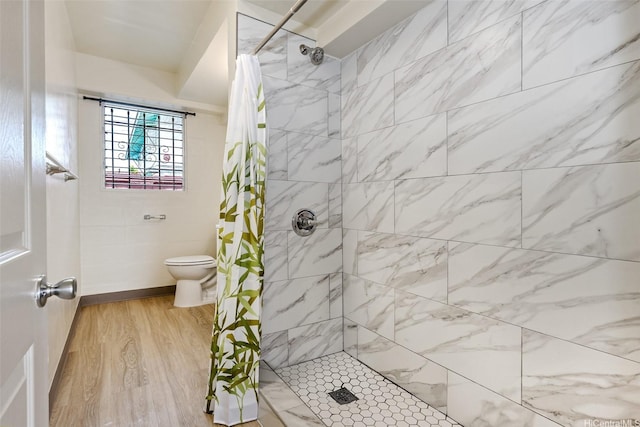 1438 Liliha St, Honolulu, HI 96817 - full bathroom with a tile shower, toilet, and wood finished floors