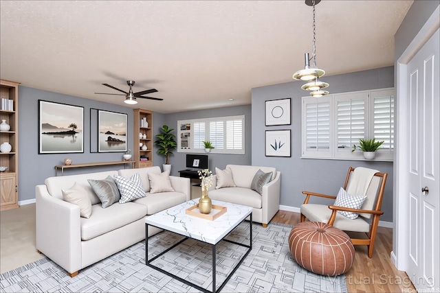 4280 Salt Lake Blvd Unit D23, Honolulu, HI 96818 - living room with a ceiling fan, baseboards, and light wood finished floors