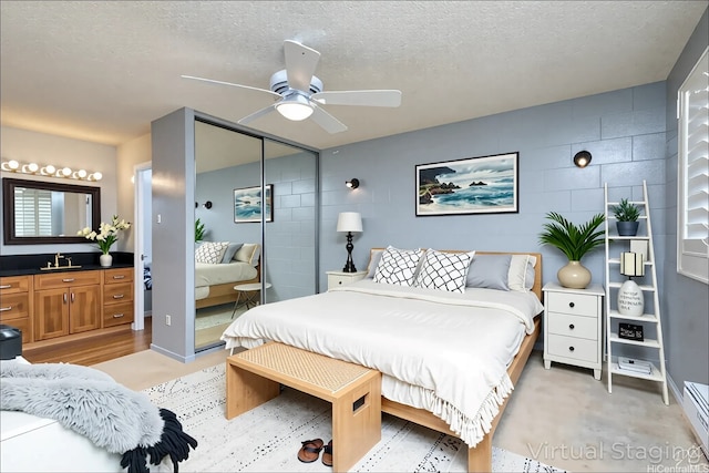 4280 Salt Lake Blvd Unit D23, Honolulu, HI 96818 - bedroom with a textured ceiling, baseboard heating, a closet, a ceiling fan, and a sink