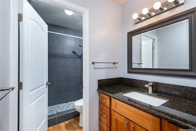 4280 Salt Lake Blvd Unit D23, Honolulu, HI 96818 - bathroom with toilet, vanity, a stall shower, and wood finished floors