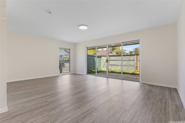 98-297 Ualo St Unit W1, Aiea, HI 96701 - unfurnished room with wood finished floors, plenty of natural light, and baseboards
