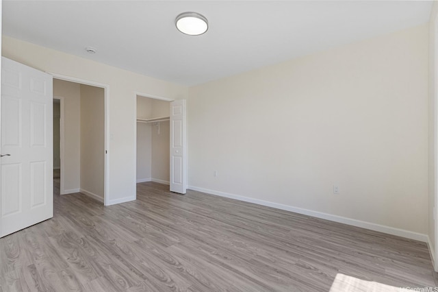 98-297 Ualo St Unit W1, Aiea, HI 96701 - unfurnished bedroom with light wood-style floors, baseboards, and a closet