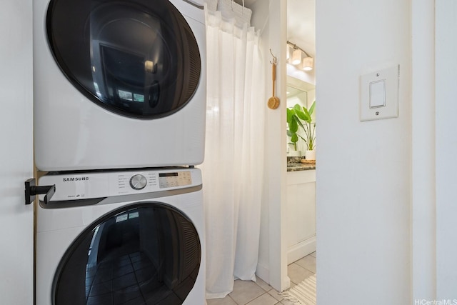 1520 Ward Ave Unit 902, Honolulu, HI 96822 - laundry area with stacked washer and clothes dryer and tile patterned floors