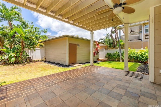 91-1019 Kai Uhu St, Ewa Beach, HI 96706 - fenced backyard featuring ceiling fan, an outbuilding, and a patio