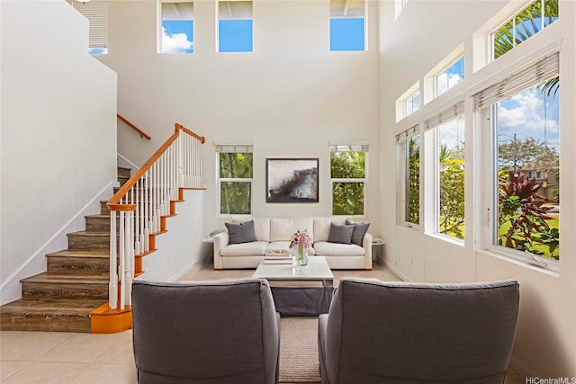 91-1019 Kai Uhu St, Ewa Beach, HI 96706 - tiled living area with a towering ceiling and stairway