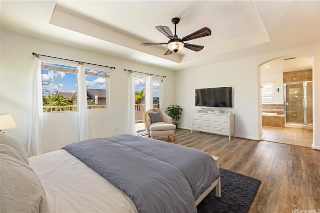 91-1019 Kai Uhu St, Ewa Beach, HI 96706 - bedroom with a raised ceiling, access to exterior, arched walkways, wood finished floors, and ensuite bathroom