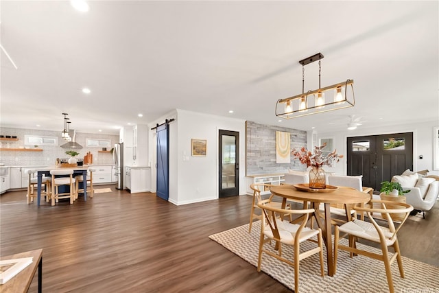 45-237 Popoki Pl, Kaneohe, HI 96744 - dining space with recessed lighting, dark wood-style flooring, a barn door, a ceiling fan, and baseboards