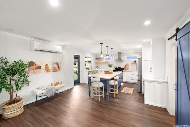 45-237 Popoki Pl, Kaneohe, HI 96744 - dining area featuring a barn door, an AC wall unit, recessed lighting, dark wood finished floors, and baseboards