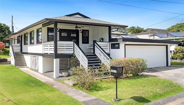 45-237 Popoki Pl, Kaneohe, HI 96744 - view of front of property featuring stairs, a ceiling fan, a front lawn, a garage, and driveway